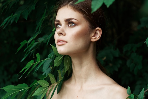 Beautiful woman cosmetology nature green leaves glamor model