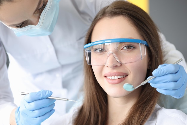 Beautiful woman at the dentist appointment closeup face