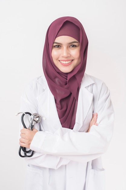 Beautiful woman doctor with hijab portrait on white background