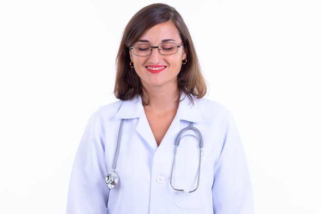  beautiful woman doctor with short hair wearing eyeglasses isolated against white wall