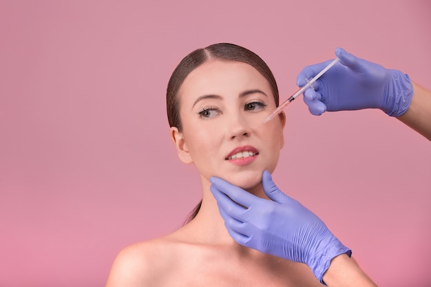 Beautiful woman doing plastic surgery