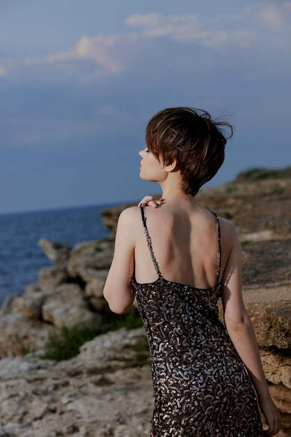 Beautiful woman in dress on nature rocks landscape luxury unaltered