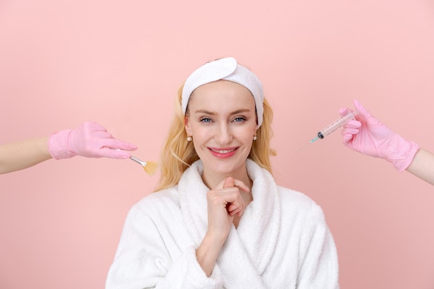 Beautiful woman dressed in white coat chooses facial procedure syringe or