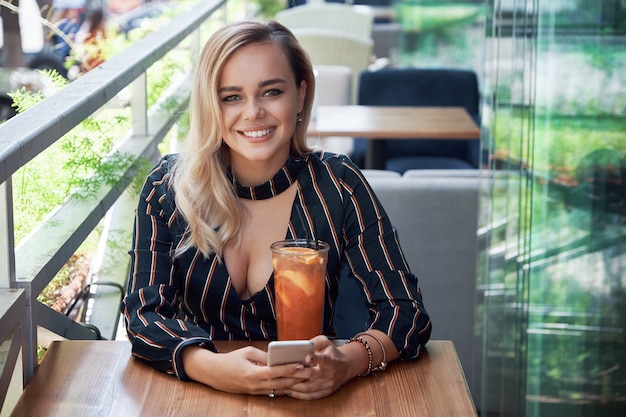 Beautiful woman drinking a cocktail