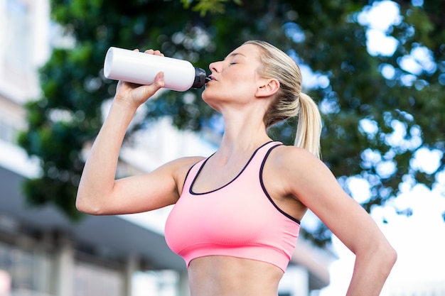 A beautiful woman drinking water 