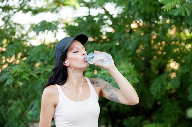 Beautiful woman drinking water 