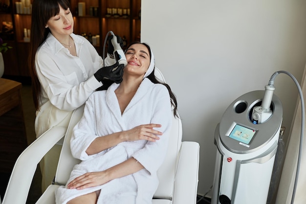 Beautiful woman enjoys buttocks massage with endosphere machine