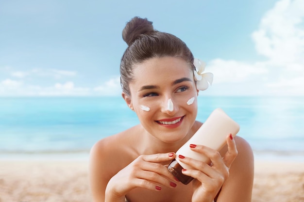 beautiful woman face sunscreen solar cream sun protectionthe girl uses moisturizer sunblock