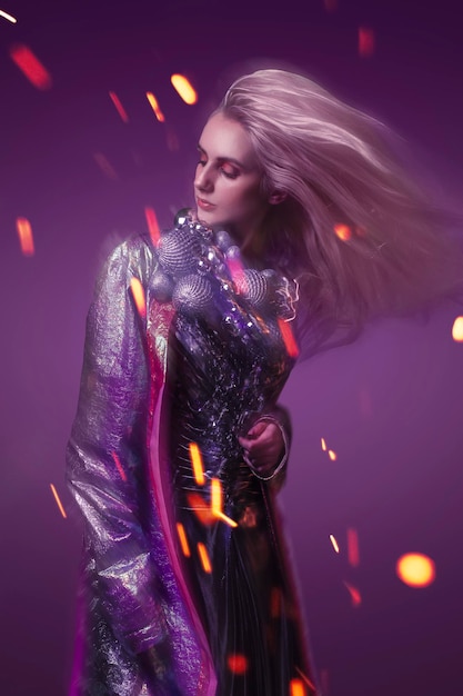 Beautiful woman in fashion look with purple background