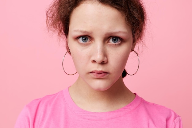 Beautiful woman fashion pink tshirt decoration posing Studio Model unaltered