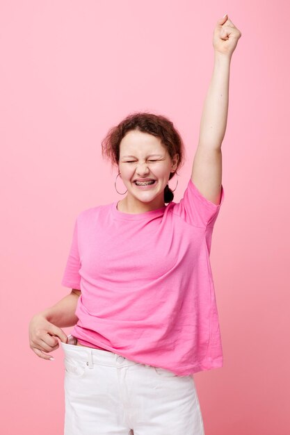 Beautiful woman fashion pink tshirt decoration posing Studio Model unaltered