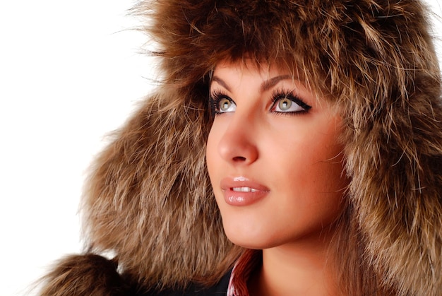 Beautiful woman in fur cap with ear flaps