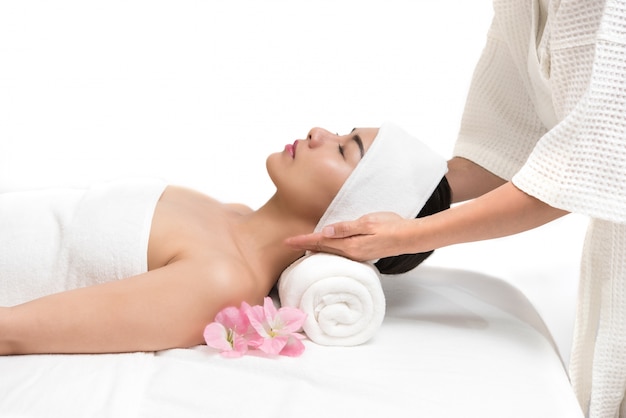 Beautiful woman getting spa massage treatment at beauty spa salon