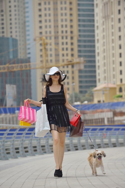 beautiful woman goes in shopping in the city