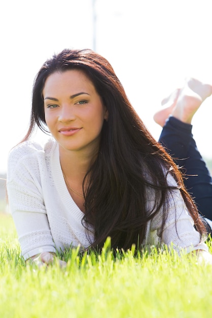 Beautiful woman on the grass