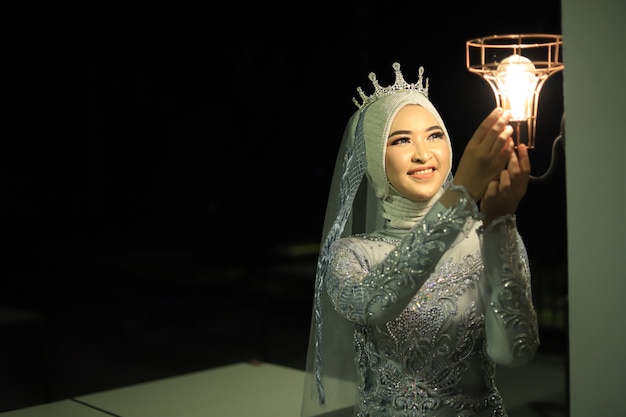 beautiful woman in gray kebaya dress