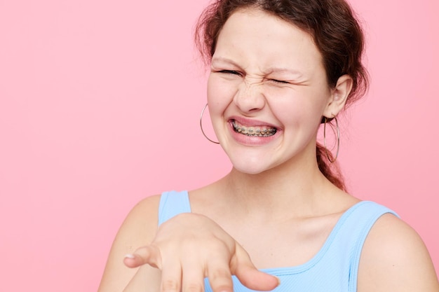 Beautiful woman grimace closeup emotions earrings posing isolated backgrounds unaltered