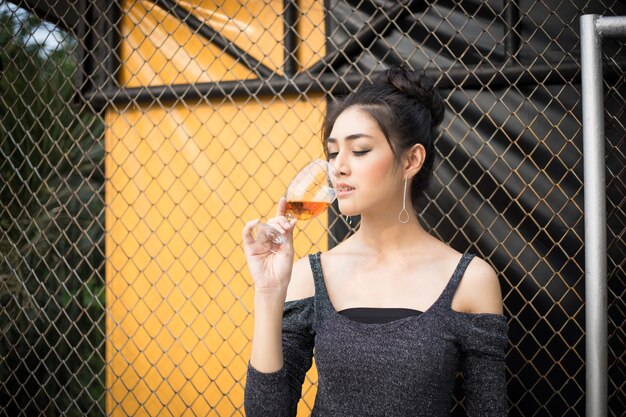 Beautiful woman hand holding wine glass  at celebration or party