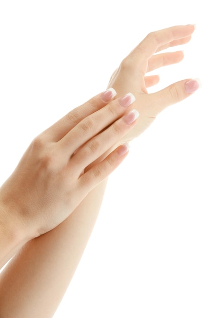 Beautiful woman hands with french manicure isolated on white