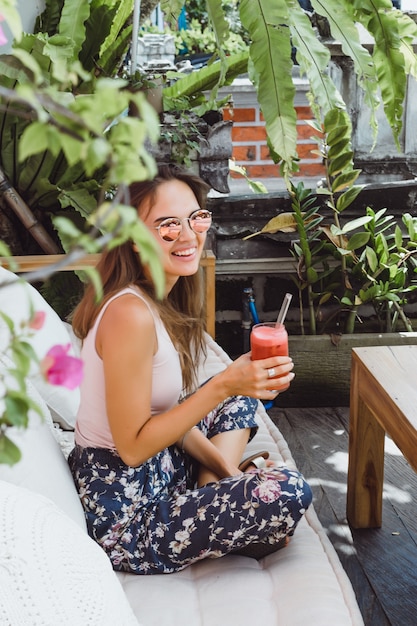 A beautiful woman has breakfast in a stylish cafe