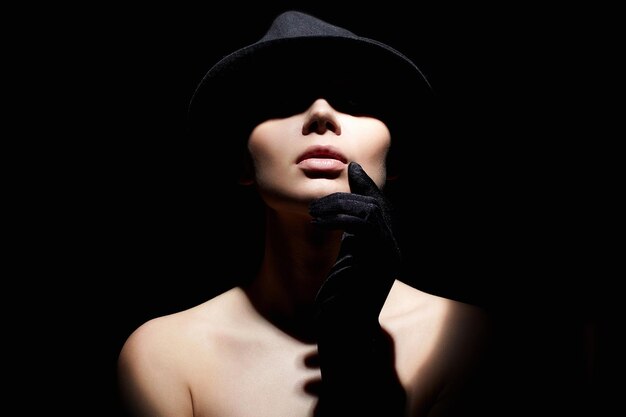 Beautiful woman in hat and gloves Retro style portrait