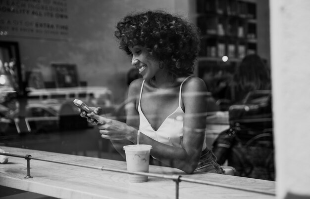 Beautiful woman having a drink inside a cafe