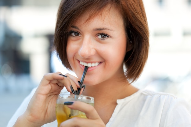 Beautiful woman having a drink