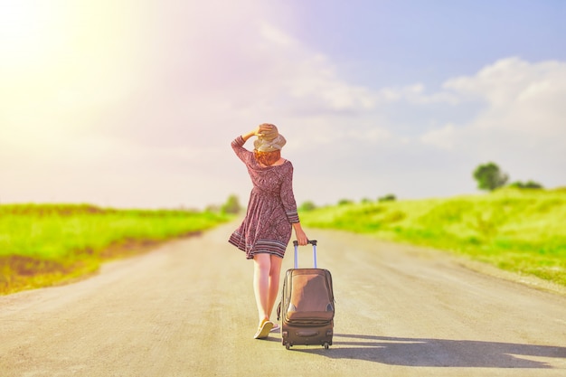 Beautiful woman hitchhiking