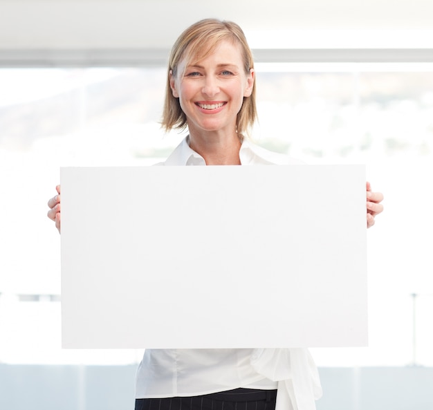 Beautiful woman holding empty white board