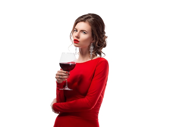 Beautiful woman holding glass of wine onwhite space