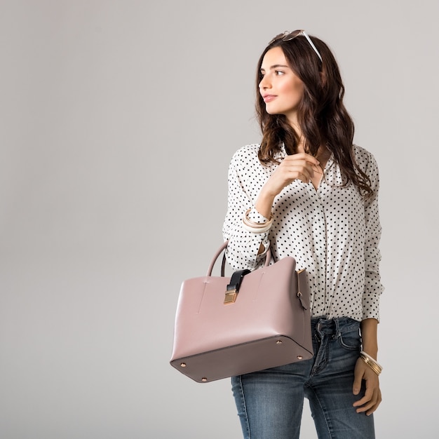 Beautiful woman holding handbag