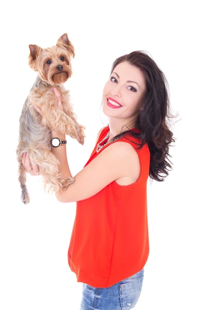 Beautiful woman holding his little dog yorkshire terrier isolated on white background