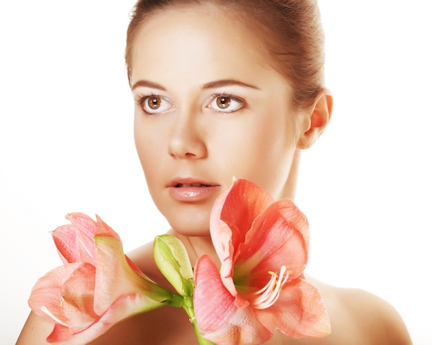 Beautiful woman holding pink flower