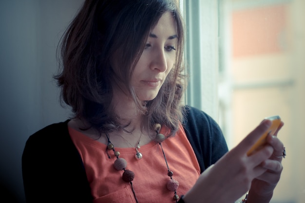 beautiful woman at home at the phone