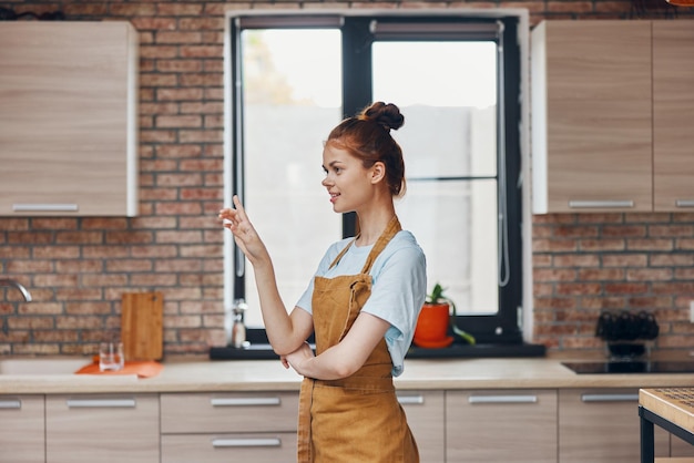 Beautiful woman houses in the kitchen apartments modern style