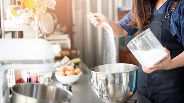 Beautiful woman is making bakery