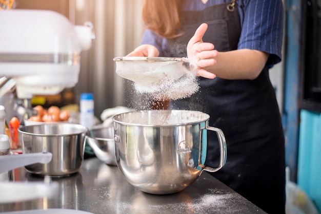 Beautiful woman is making bakery