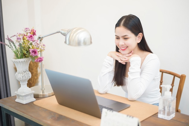 Beautiful woman is working from home