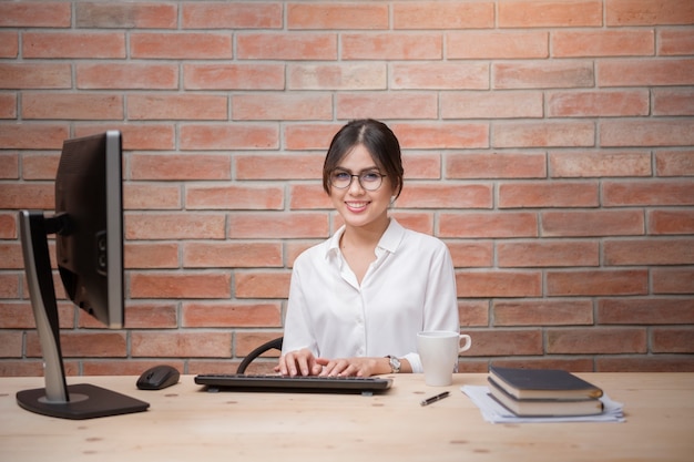 Beautiful woman is working in home office 