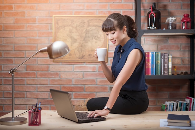 Beautiful woman is working in home office 