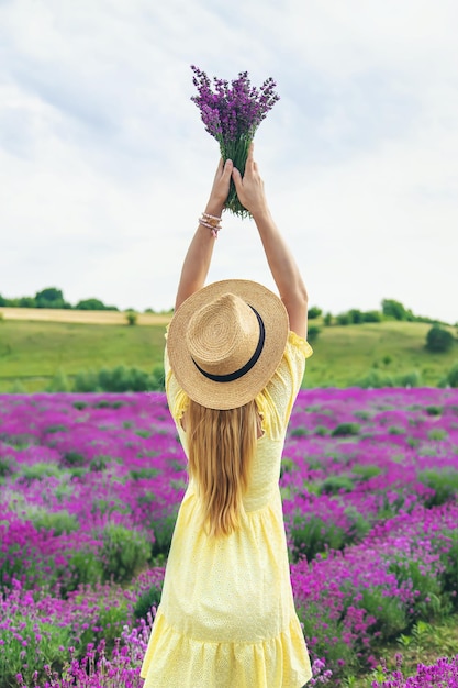 Beautiful woman in lavender field Selective focus