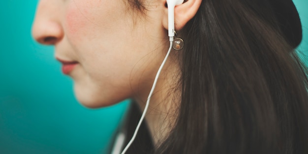 Beautiful woman listening music trendy concept