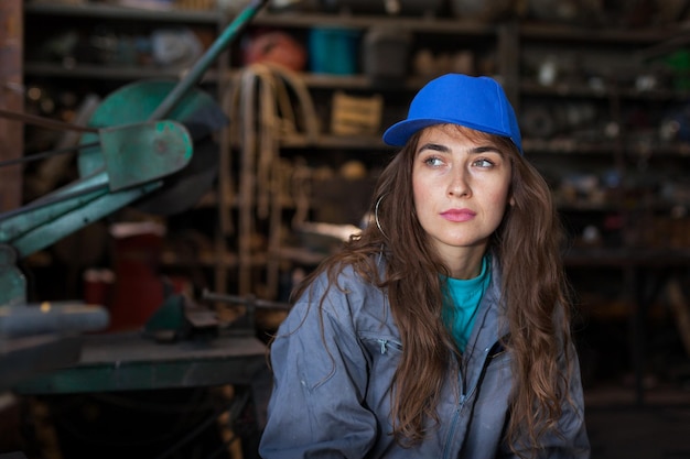 Beautiful woman looking away at workshop