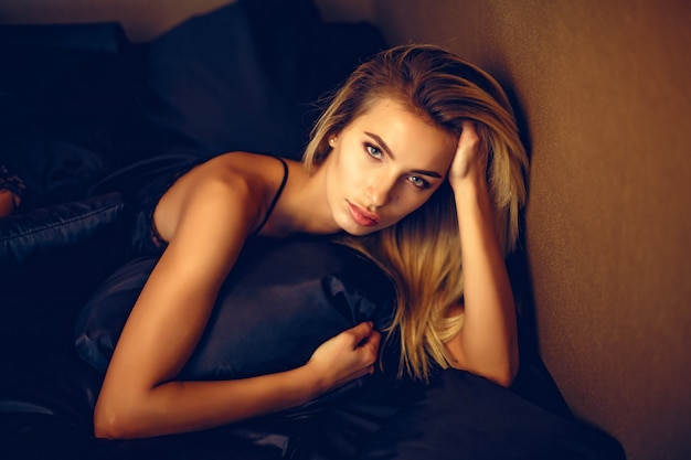 Beautiful woman lying on bed 