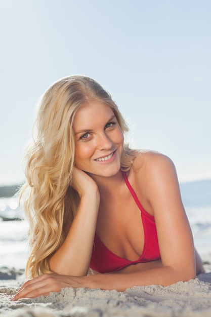 Beautiful woman lying down on the beach