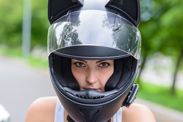 Beautiful woman in motorcycle helmet