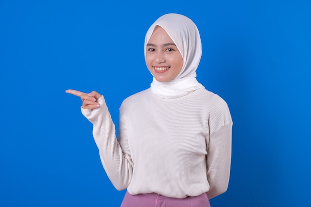 Beautiful woman muslim pointing her index finger