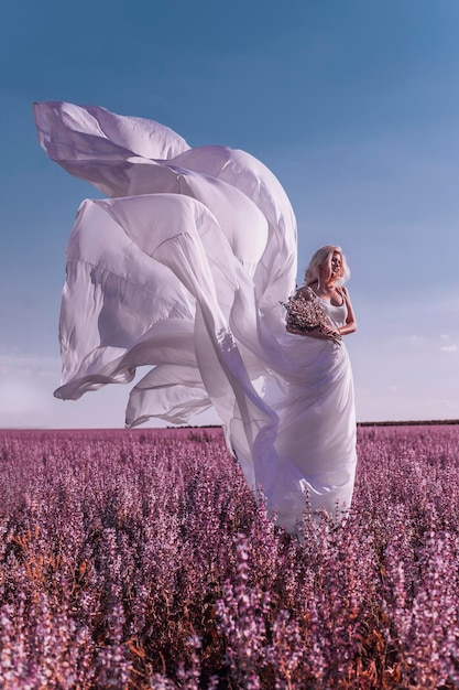 Beautiful woman in pink field