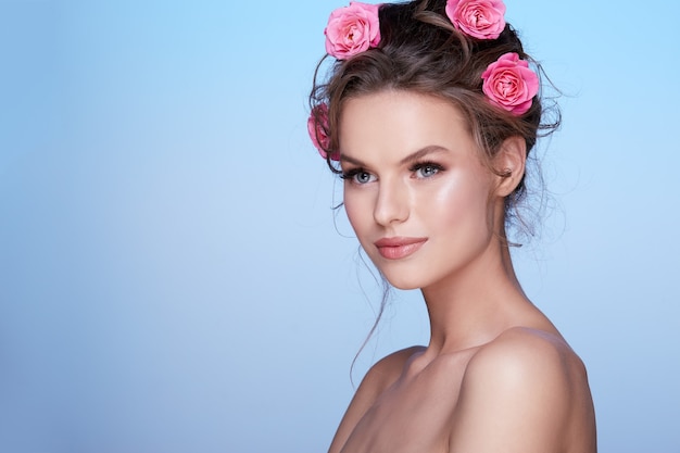 Beautiful woman portrait with flower on the head