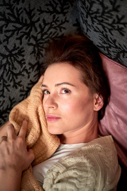 Beautiful woman posing in the bed